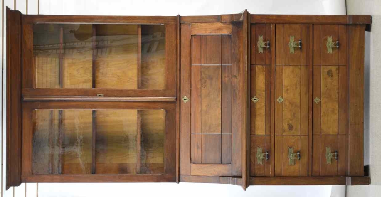 Appraisal: VICTORIAN WALNUT SLANT-FRONT SECRETARY BOOKCASE Eastlake design American c the