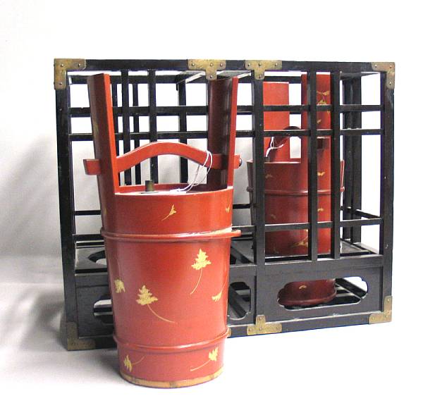 Appraisal: A pair of Japanese lacquered wood sake casks with carrying