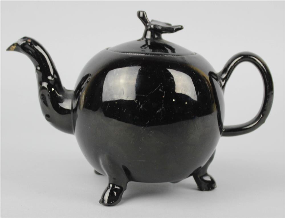 Appraisal: JACKFIELD TYPE BLACK-GLAZED TEAPOT AND COVER ca globular with bird