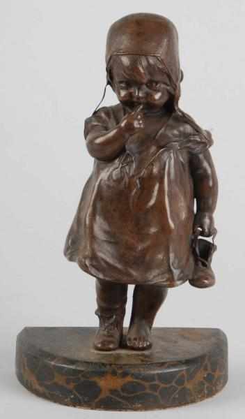 Appraisal: Cast Iron Child Holding Shoe Doorstop Description Made by Bradley