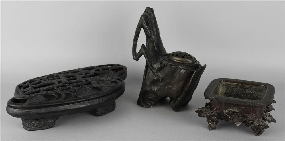 Appraisal: THREE JAPANESE BRONZE IKEBANA VESSELS MEIJI PERIOD the first a