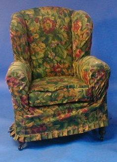 Appraisal: A Victorian wing back armchair with floral loose covers