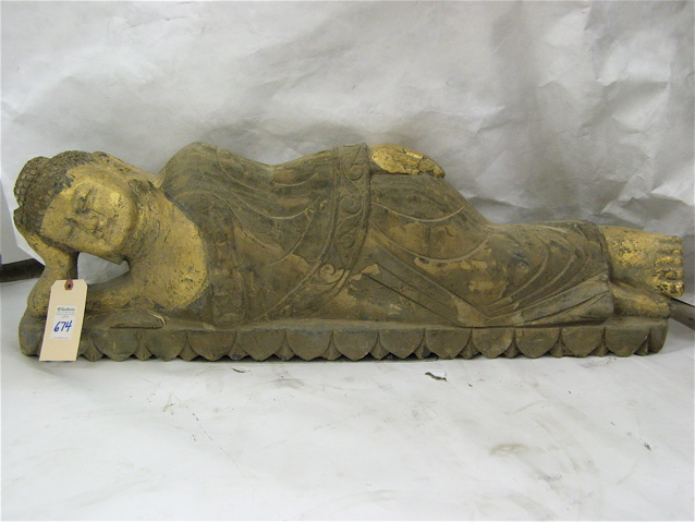 Appraisal: CHINESE CARVED AND PARCEL-GILT GRANITE SCULPTURE the figure of a