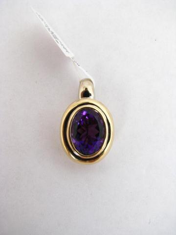 Appraisal: Lady's k yellow gold amethyst oval pendant