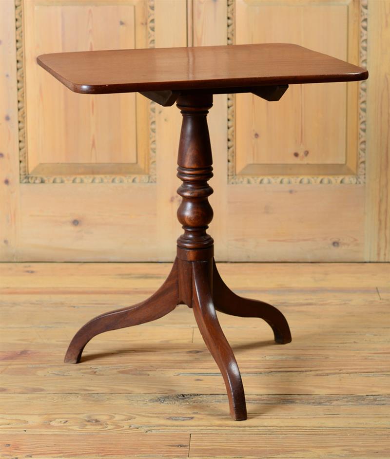 Appraisal: REGENCY MAHOGANY TRIPOD TABLE With a rectangular top raised on