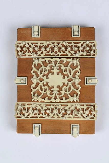 Appraisal: AN INDIAN SANDALWOOD AND IVORY CARD CASE with pierced panels