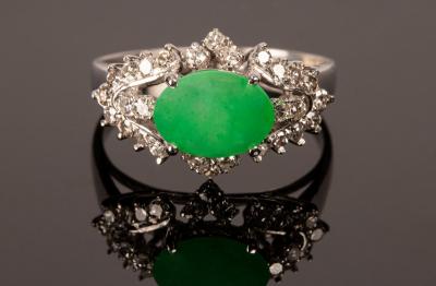 Appraisal: A jade and diamond dress ring set in k white