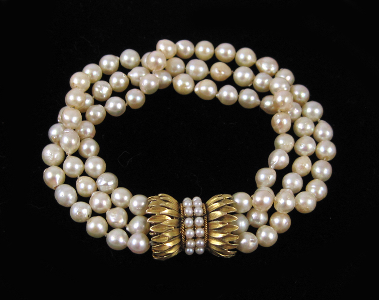 Appraisal: TRIPLE STRAND PEARL BRACELET with three strands of well matched