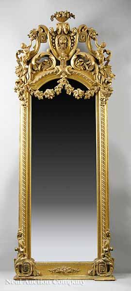 Appraisal: An American Rococo Carved Giltwood Mirror mid- th c the