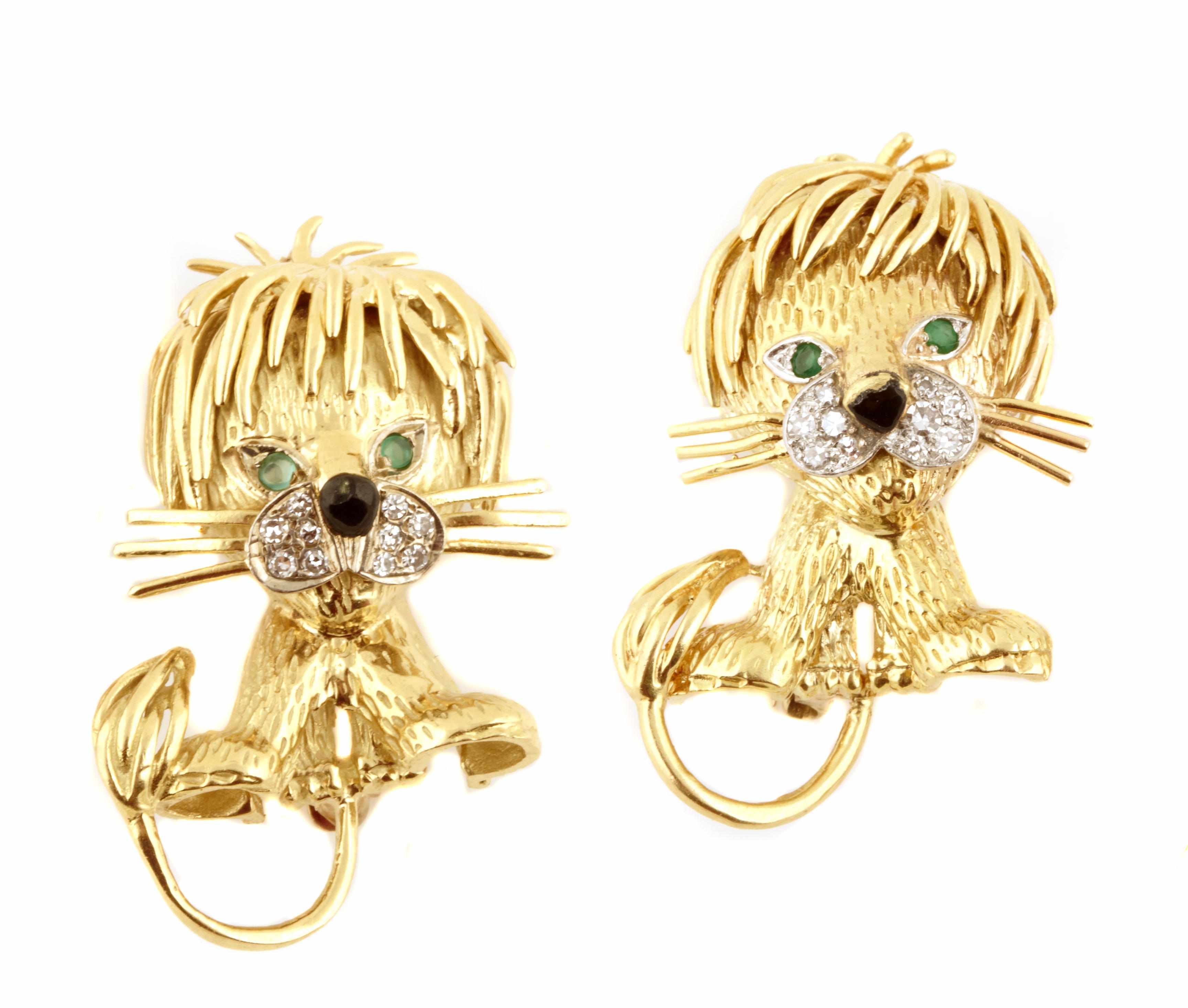 Appraisal: A pair of gem-set diamond and gold lion brooches