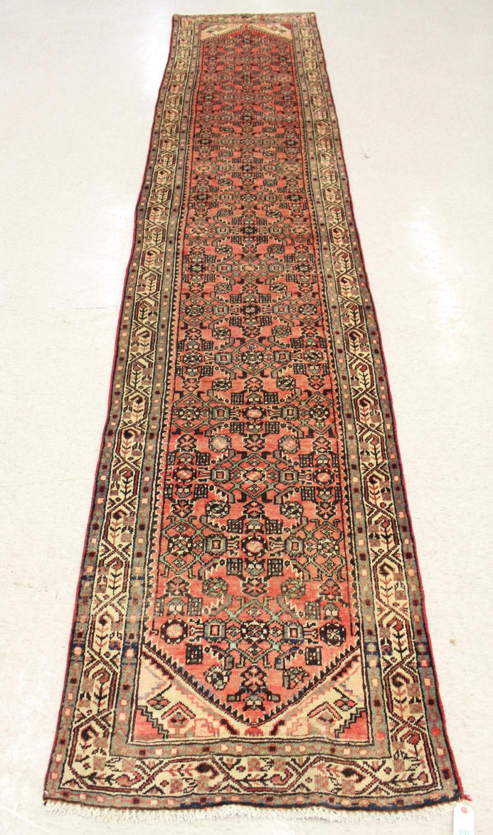 Appraisal: HAND KNOTTED PERSIAN RUNNER overall Herati floral motif on red