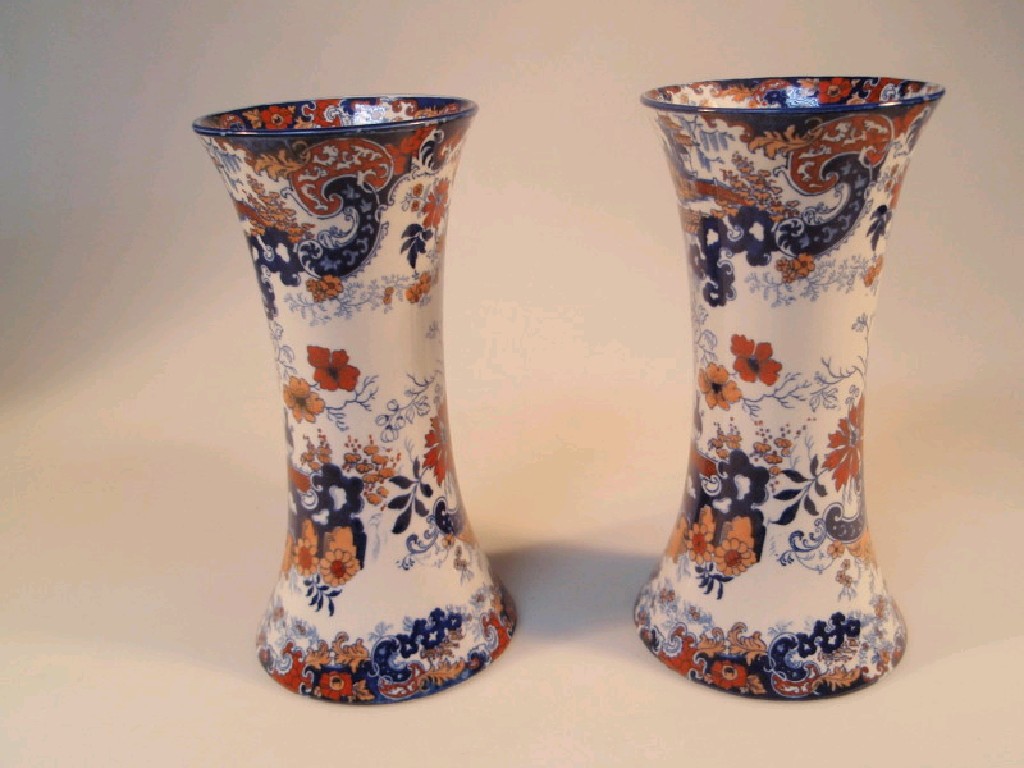 Appraisal: A pair of Staffordshire pottery vases of swept circular form