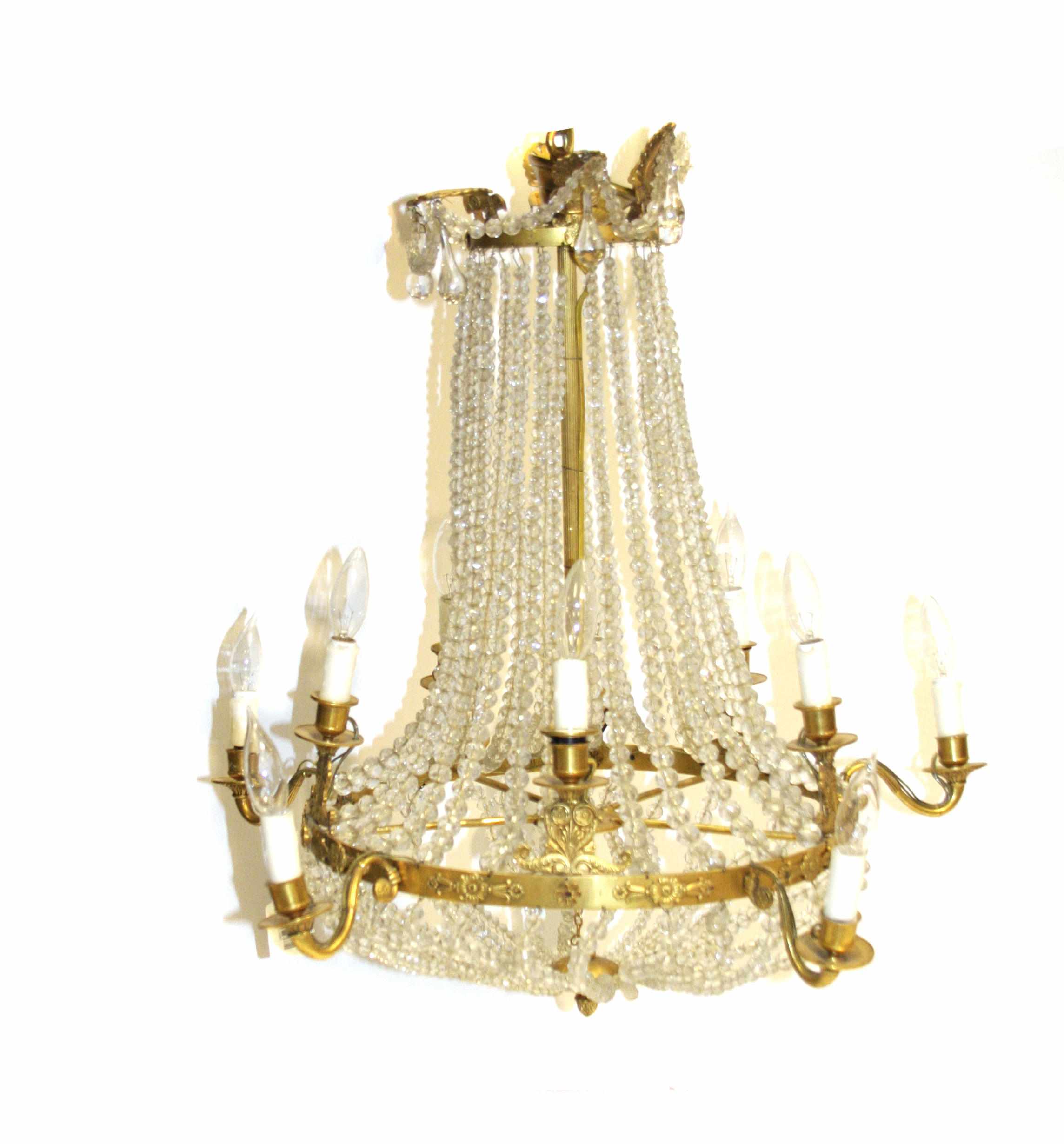 Appraisal: An Empire style gilt bronze and glass ten light chandelier