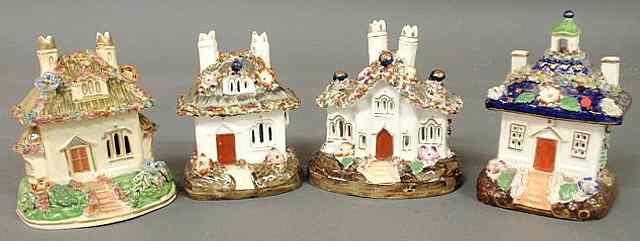 Appraisal: Four colorful th c Staffordshire cottage pastille burners each approx