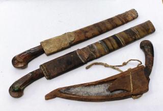 Appraisal: Vintage Ethnic Tribal Knives in Scabbards Comprising two Malayan parangs