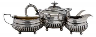 Appraisal: Three Piece English Silver Tea Service London urn forms with