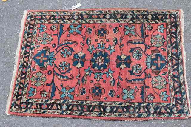 Appraisal: A PERSIAN RUG with foliate decoration and triple border '