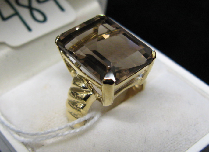 Appraisal: SMOKY QUARTZ AND FOURTEEN KARAT GOLD RING set with a