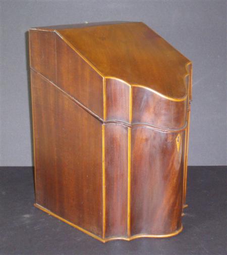 Appraisal: A George III mahogany serpentine knife box with boxwood and