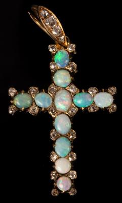 Appraisal: An opal and diamond set cross in an unhallmarked yellow