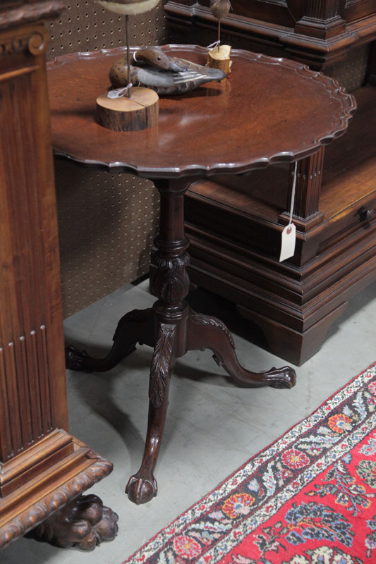 Appraisal: TILT TOP TABLE Mahogany with a pie crust top carved