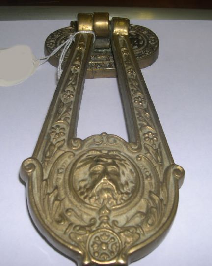 Appraisal: English Gilt-Brass Doorknocker in the Renaissance taste the attenuated lyriform