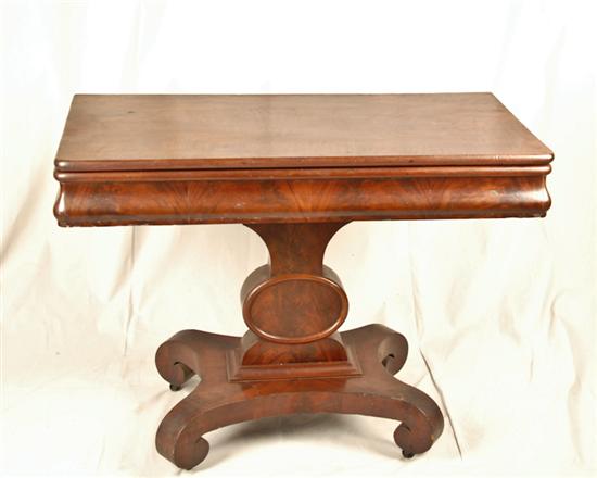 Appraisal: A Mahogany Empire Folding-top Game Table each half of the