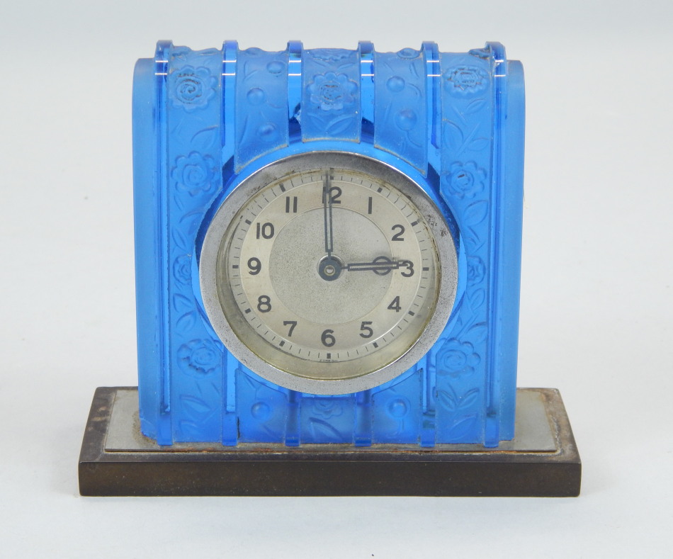 Appraisal: An Art Deco style blue glass mantel timepiece decorated in