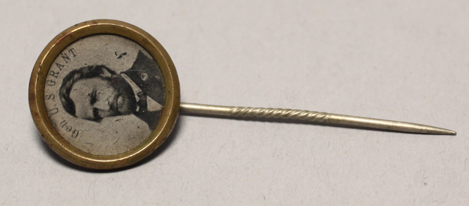 Appraisal: CIRCULAR BRASS GENERAL GRANT CAMPAIGN STICKPIN Civil War PeriodLength