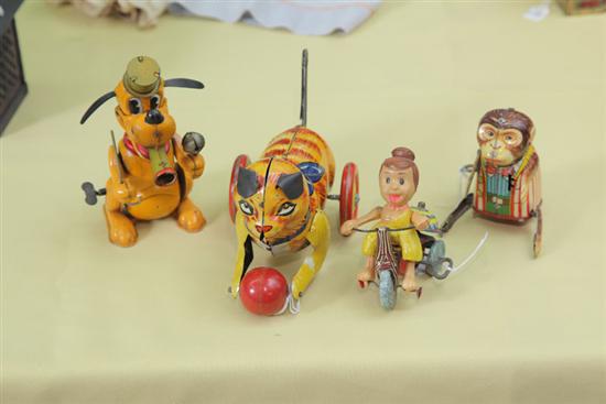 Appraisal: FOUR WIND-UP TOYS Tin lithographed Walt Disney Pluto figure ''h