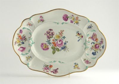 Appraisal: A moulded Meissen dish painted with flower sprays in polychrome