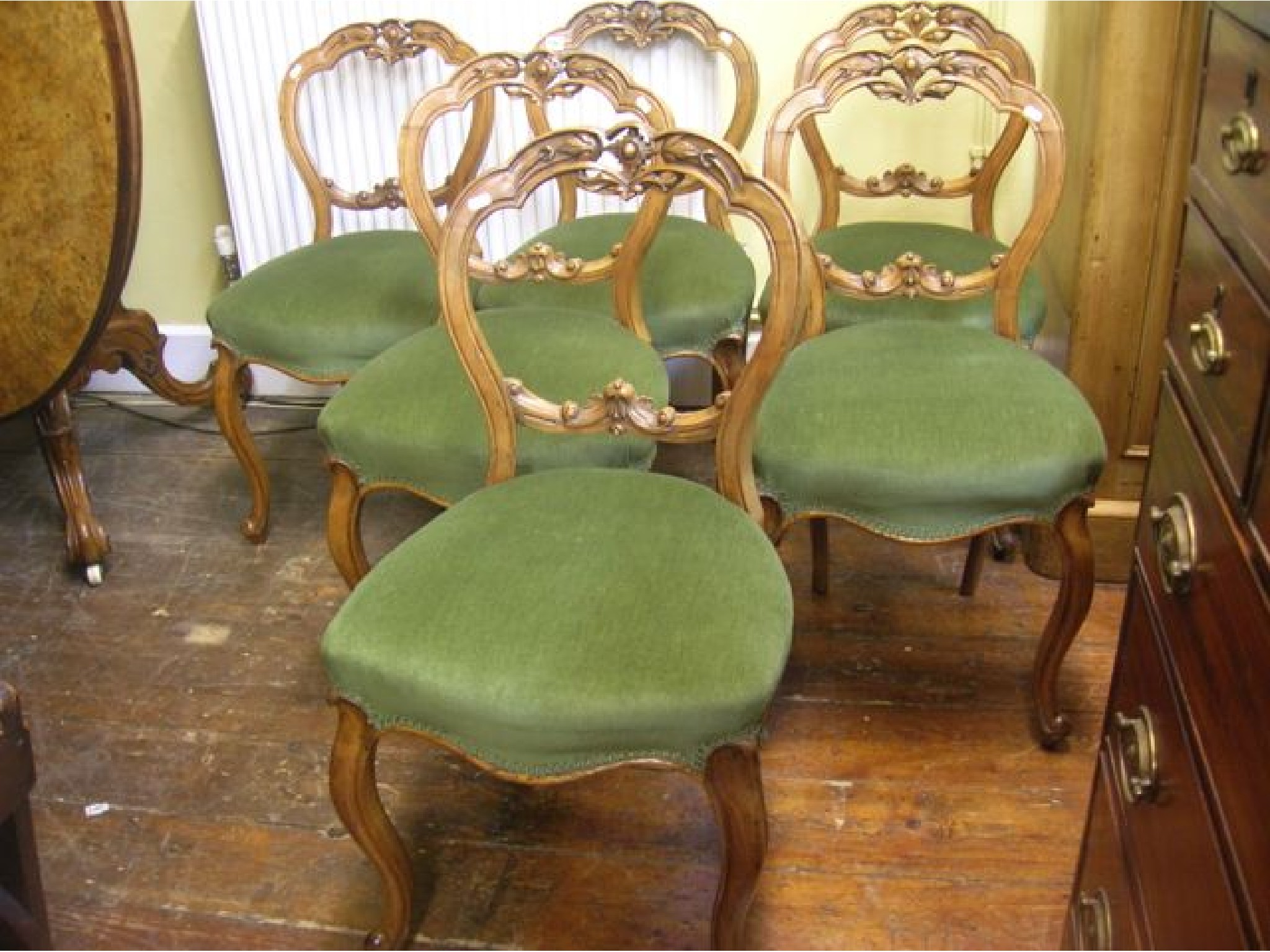 Appraisal: A set of six Victorian walnut balloonback dinig chairs with