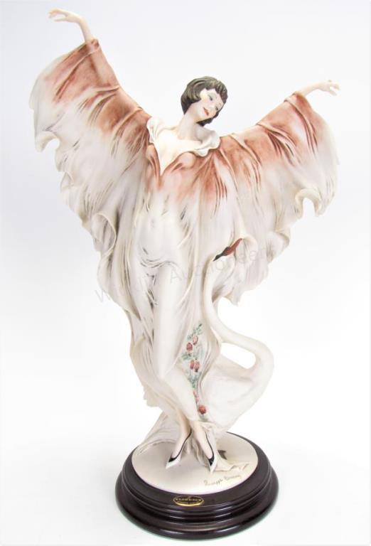 Appraisal: Giuseppe Armani Woman with Swan Figure resin figure of woman