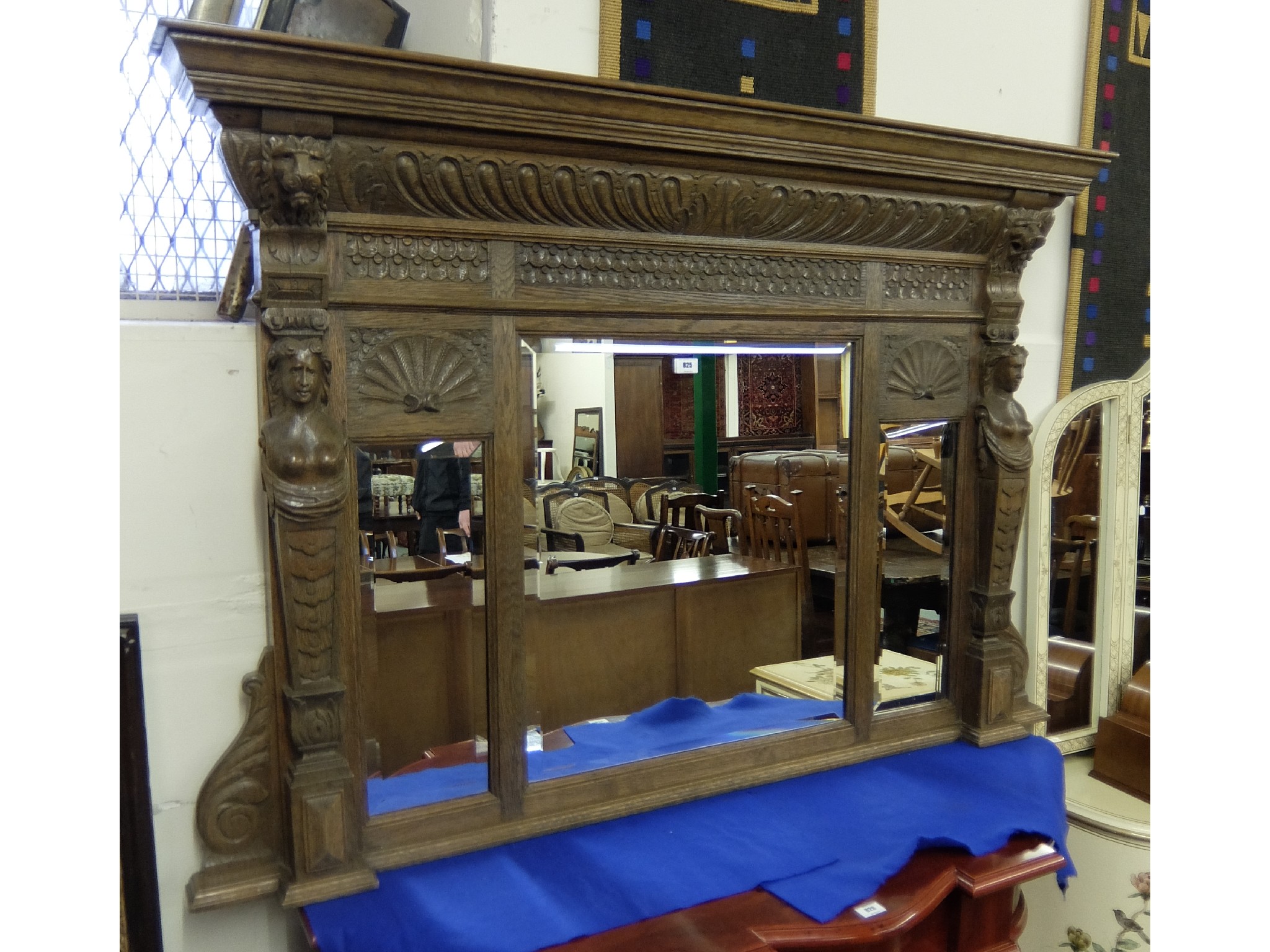 Appraisal: Carved oak overmantel mirror with figure and lion mask finials