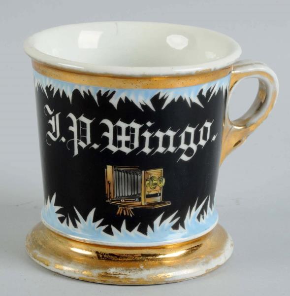 Appraisal: Camera Shaving Mug Unusual mug depicts an early camera on