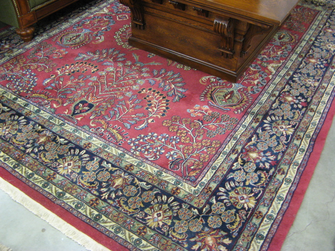 Appraisal: HAND KNOTTED ORIENTAL CARPET Persian Sarouk design overall floral sprig