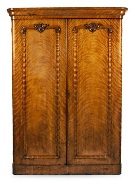 Appraisal: A Victorian satin birch two door wardrobe the projected moulded