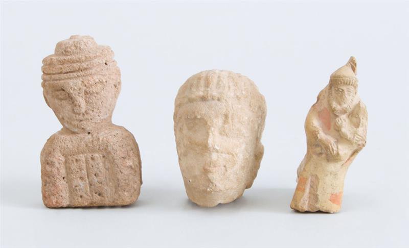 Appraisal: TWO CARVED STONE FIGURAL FRAGMENTS Together with a terracotta figural