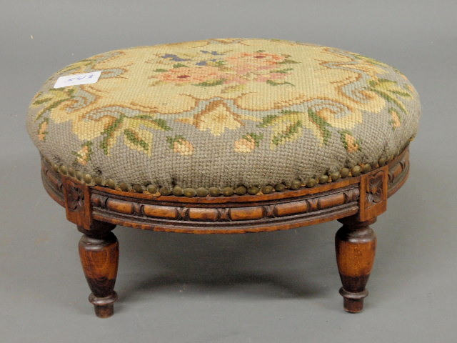 Appraisal: Round footstool with needlepoint top h x dia