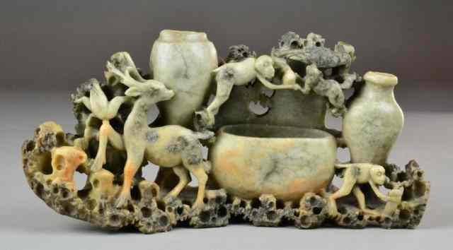 Appraisal: Chinese Carved Soapstone Deer and MonkeysCarved soapstone sculpture of well