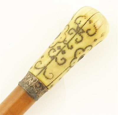 Appraisal: An early th century turned bone and pique cane handle