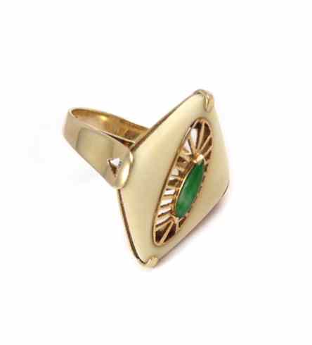 Appraisal: JADE IVORY AND FOURTEEN KARAT GOLD RING the ivory surrounds