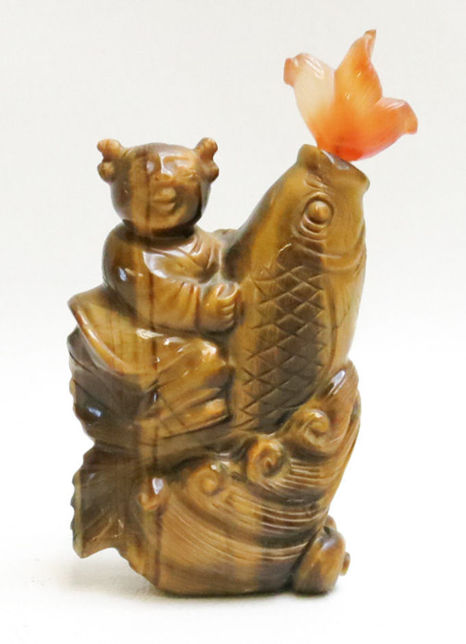 Appraisal: CHINESE CARVED TIGER'S EYE SNUFF BOTTLE depicting a man riding