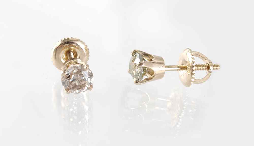 Appraisal: CTW SOLITAIRE EARRINGS K yellow gold earrings contain one old