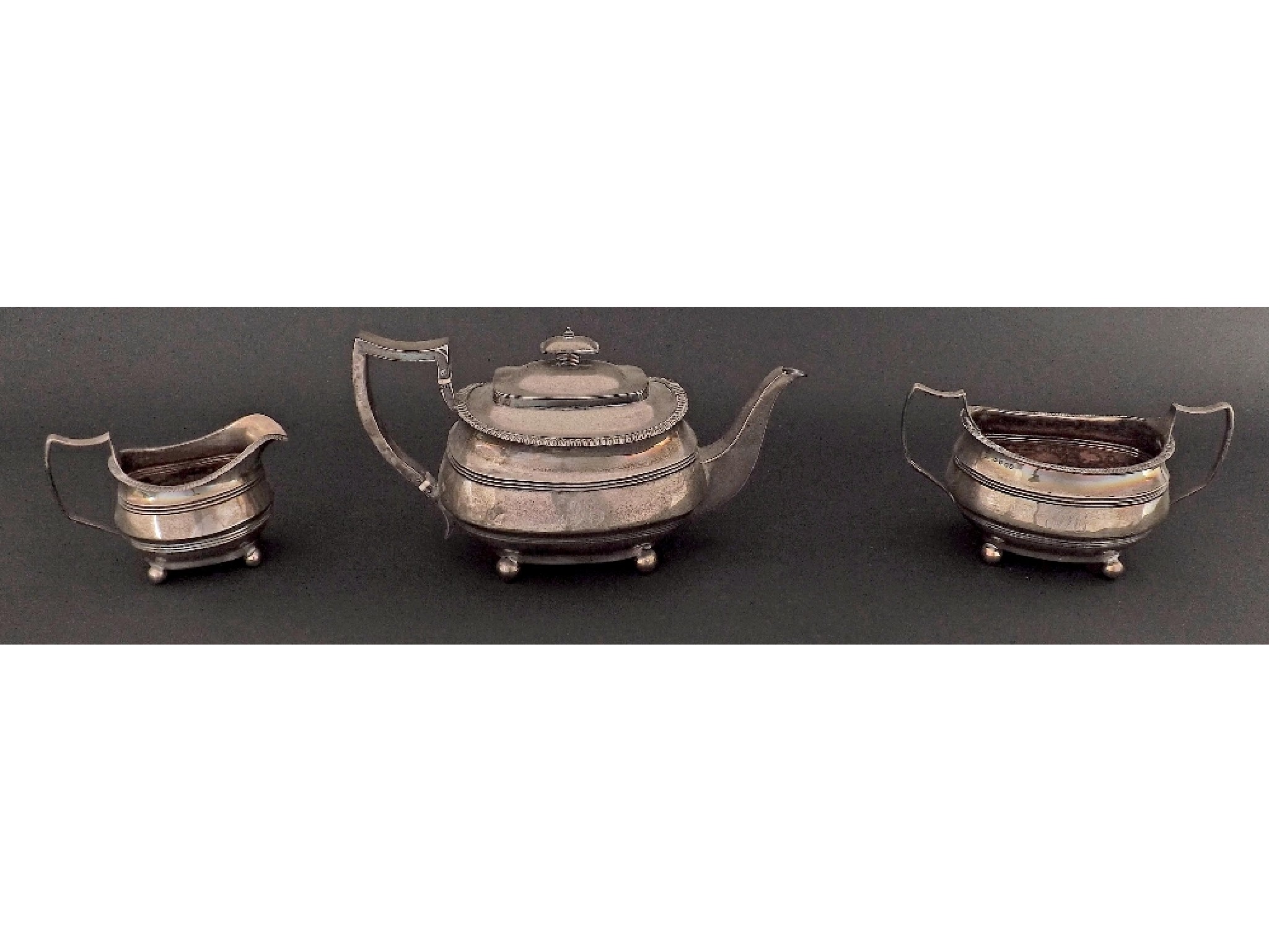 Appraisal: Late George III silver three piece tea service comprising teapot