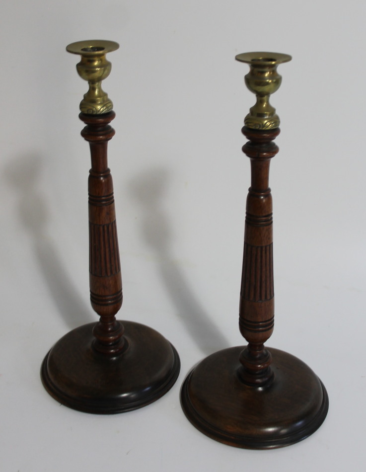 Appraisal: A pair of early thC oak candlesticks with reeded and