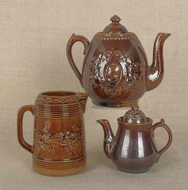 Appraisal: Seven pieces of pottery with Rockingham glaze late th c