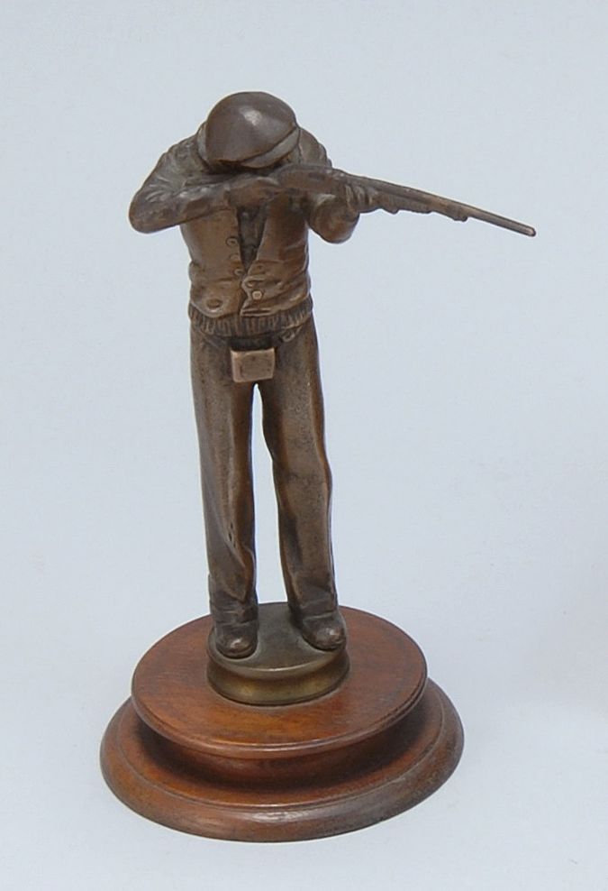 Appraisal: BRONZE FIGURAL SHOOTING TROPHY In the form of a gentleman