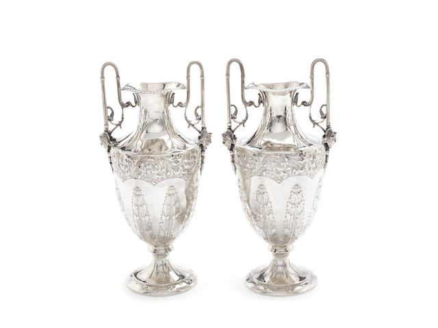 Appraisal: A pair of Edwardian silver two-handled vases makers marks rubbed