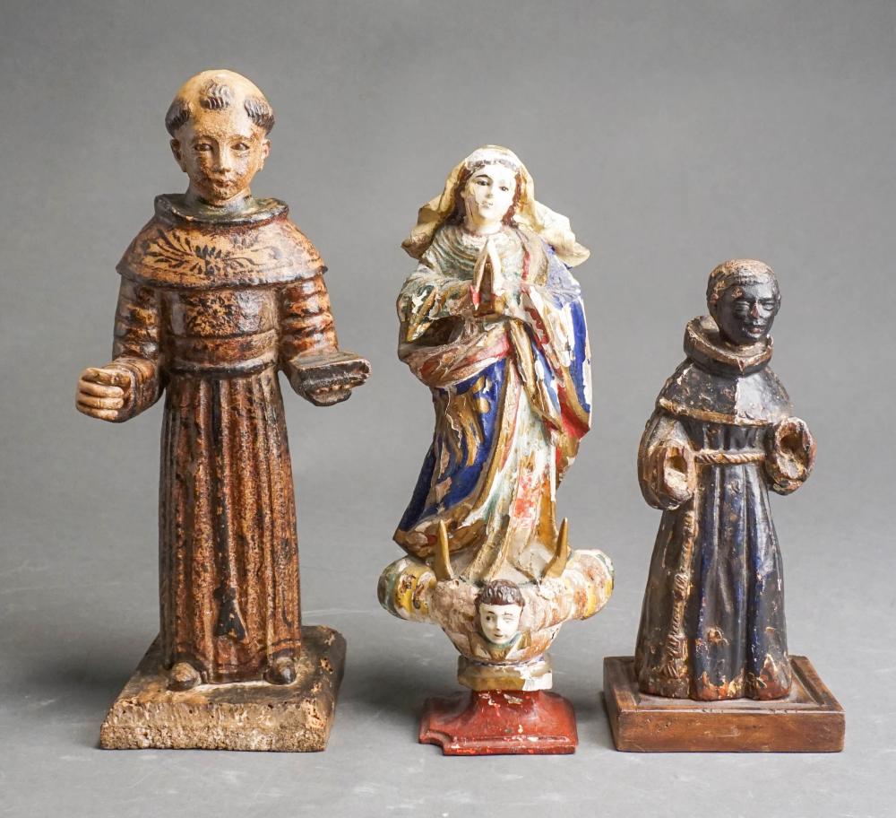 Appraisal: THREE SANTOS CARVED AND PAINTED WOOD FIGURES H OF TALLER